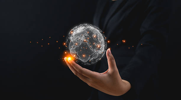 istock A hand holds a glowing, digital globe, symbolizing technology, connectivity, and the global landscape in a dark setting. 2252721110