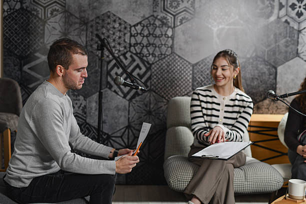istock Casual Podcast Studio Moment With Guest Explaining Topic to Audience 2252721707