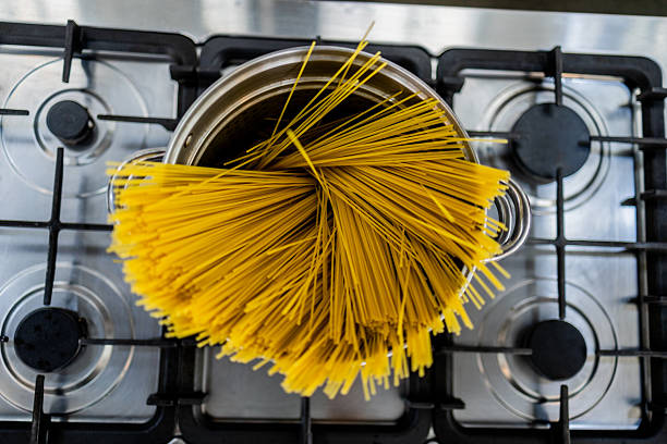 Close-up of spaghetti cooking in a pan
