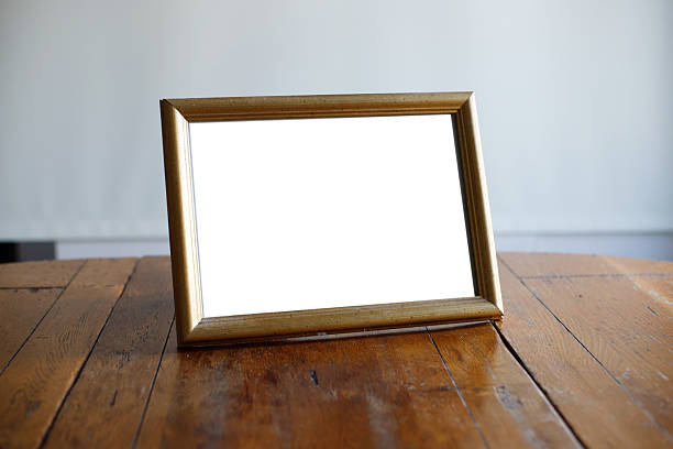 istock A4 Paper and Frame on Wood Table with Coffee Mock up 2252727418