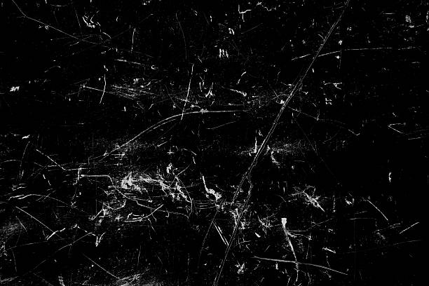 istock Dark grunge texture overlay with scratches, scuffs, and distressed marks on black background. 2252727903
