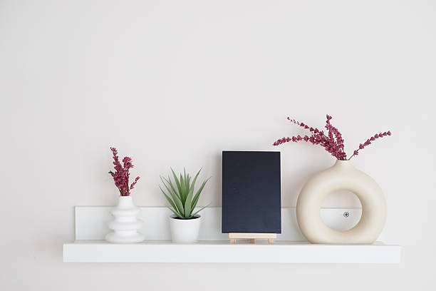 istock Decorative shelf with minimalistic plants and display items 2252728047