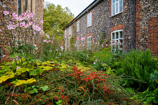 Firle, England - 29 July, 2025: exterior façade of a charming English countryside cottage in the picturesque village of Firle, East Sussex in southeast England.