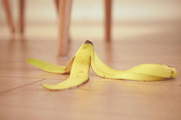 Discarded banana peel isolated on a white background, showing natural folds and organic shape.