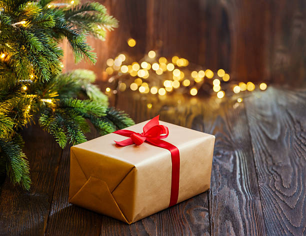 istock Christmas holidays composition with gift box on wooden background. 2252730956