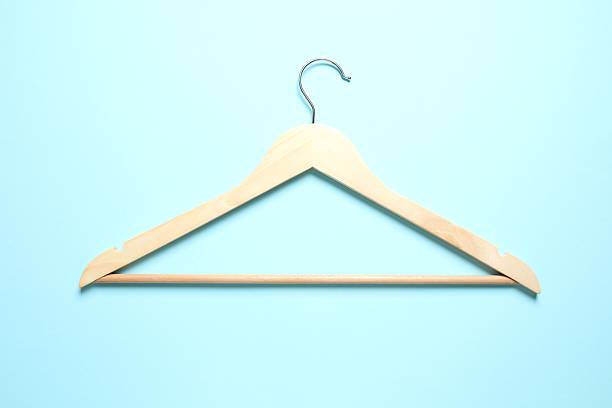 istock Wooden clothes hanger on a colored background 2252730959