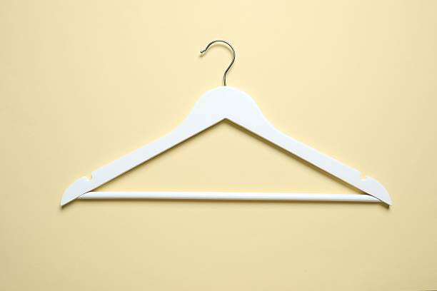 istock Wooden clothes hanger on a colored background 2252730986