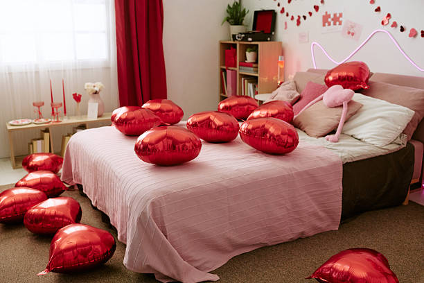 istock Heart Shaped Balloons Scattering Across Bed in Romantic Valentines Day Setting 2252731077