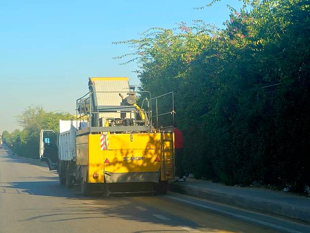 Cairo, Egypt, December 18 2025: heavy machinery used for road cleaning operations, likely a road milling machine or a large scale road sweeper, designed for efficient maintenance of road surface