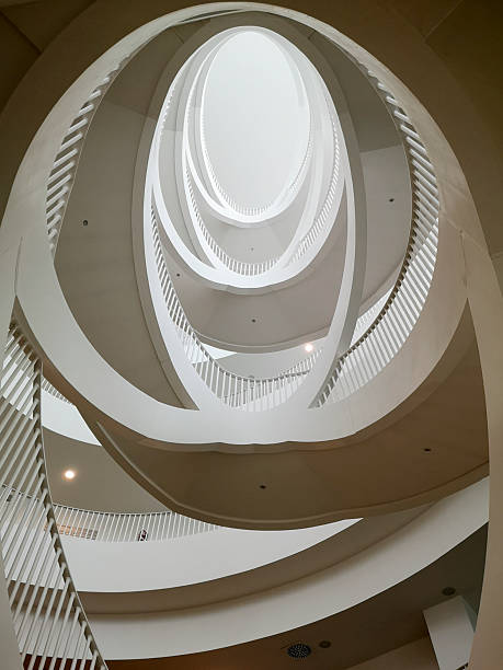 Old-fashioned square shaped spiral staircase- Black and white and low angle shot