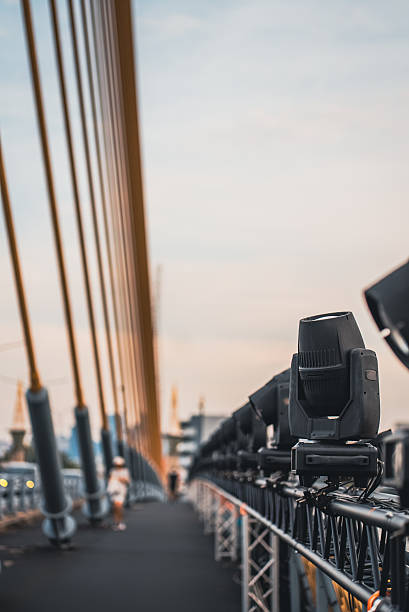 istock spotlights and projector lamps illuminating cable-stayed bridge at night, professional lighting equipment setup on suspension cable stayed bridge evening 2252731972