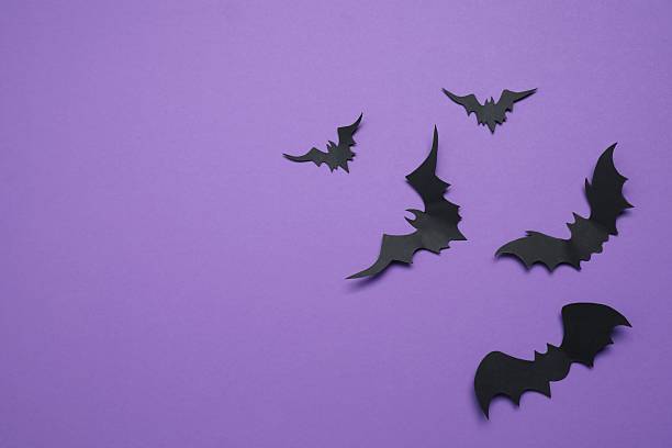 istock Black bats on purple background. Halloween concept 2252732498