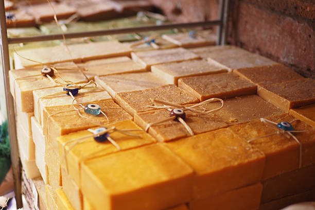Colorful soap bars neatly arranged for sale at a communal market.