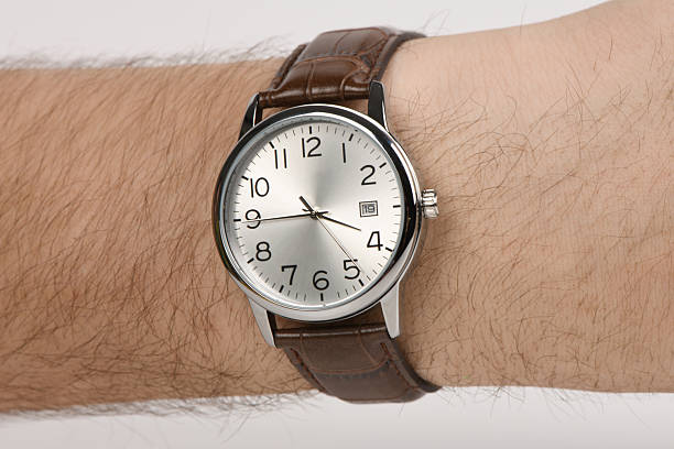 istock Classic silver analog wristwatch with brown leather strap on mal 2252733024
