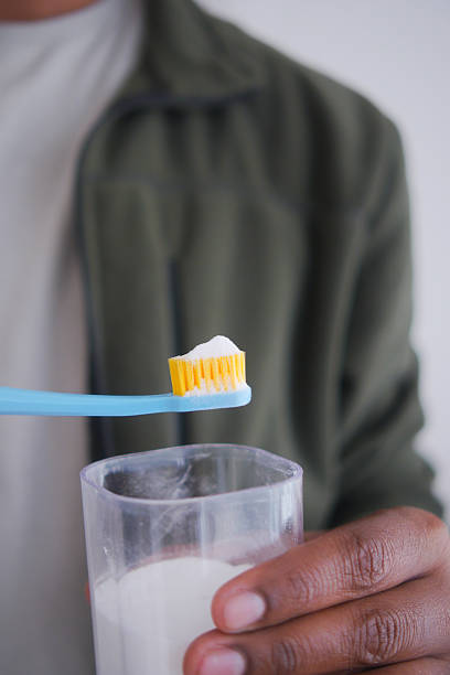 istock Brushing teeth with a toothbrush and soda power 2252733587