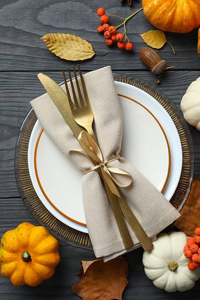 istock Rustic holiday table setup. Top view with plates, cutlery and autumn decorations. Empty space for your text 2252734351