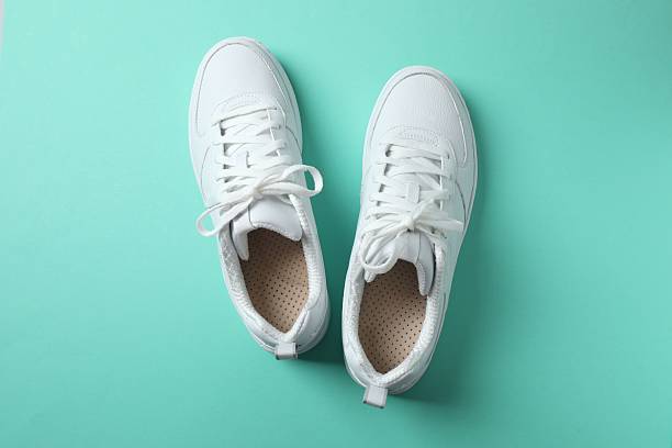 istock White sneakers on a color background 2252735930