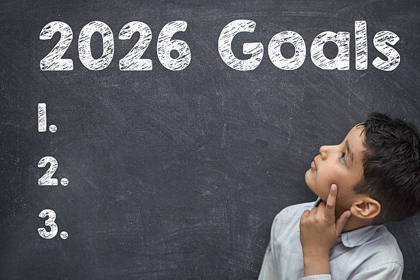 istock 2026 Goals Planning Concept with Thinking Child and Chalkboard List 2252736013