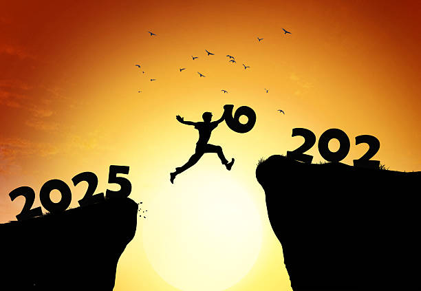 istock Jumping from 2025 to 2026 New Year Transition Concept with Silhouette at Sunset 2252736250