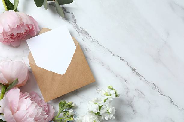 istock Beautiful frame with paper envelope, flowers and peonies,  space for text 2252737837