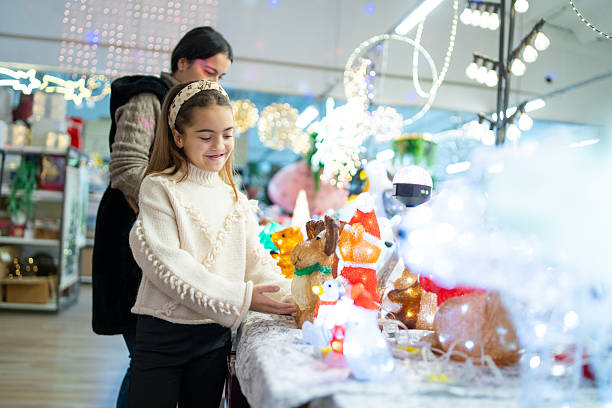 Girl with mom buying decorations