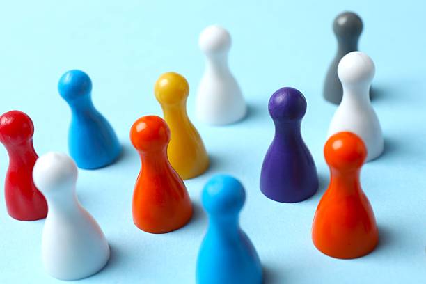 istock Group of pawns on the table. Concept of unity 2252738582