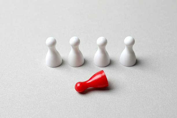 istock Group of pawns on the table. Concept of unity 2252738583
