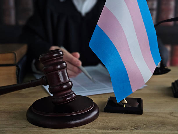 istock Judge writes on document with gavel and transgender flag 2252739473