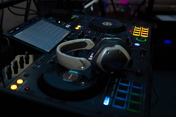 istock DJ headphones resting on professional wedding mixing console at event 2252739522