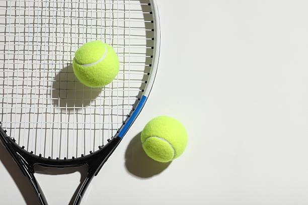 istock Tennis racket and balls on grey background 2252739712
