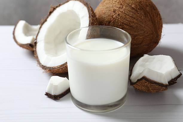 istock Glass of milk with coconuts on the table 2252739837