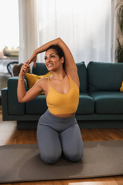 istock Indian Woman Stretching In Home 2252739881
