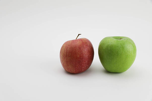 Red And Green Apples Side By Side On A Clean White Background, Highlighting Contrast In Color, Texture, And Freshness — Ideal For Concepts Of Choice, Comparison, Nutrition, And Healthy Eating.