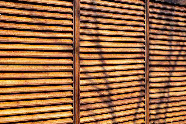 Wooden blinds wall under sunlight