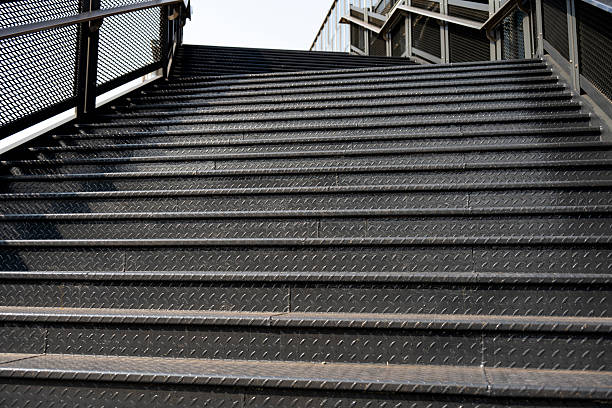 A modern urban staircase featuring metal railings, suitable for architectural or infrastructure projects.