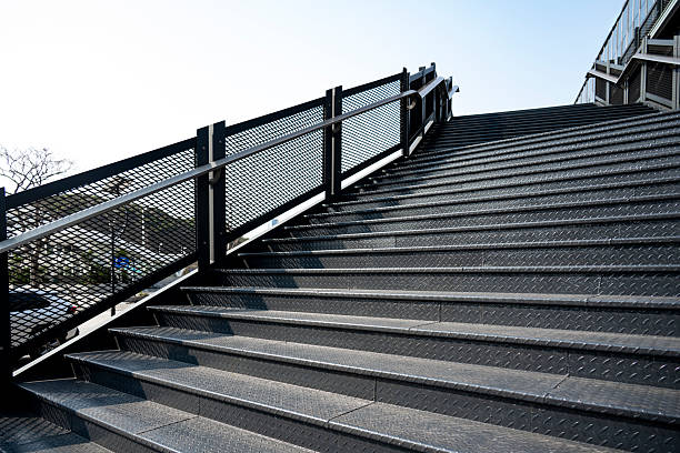 A modern urban staircase featuring metal railings, suitable for architectural or infrastructure projects.
