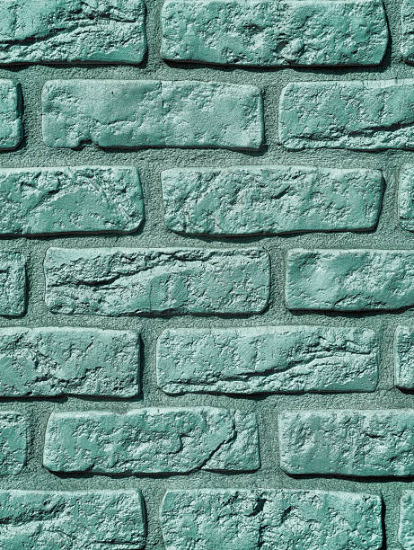 istock Turquoise Painted Brick Wall Texture with Mint Green Rough Surface for Modern Design Projects Copy Space Background 2252742789