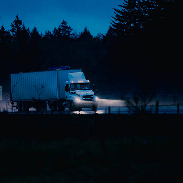 istock Semi-Truck on Freeway in the Rain 2252746683
