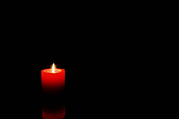 istock Red Candles Illuminating the Darkness 2252746999
