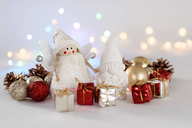 A festive handmade male Christmas gnome featuring a tall green hat adorned with a star and candy cane decoration. The gnome has a long white beard, adding a traditional and whimsical touch to holiday decor.