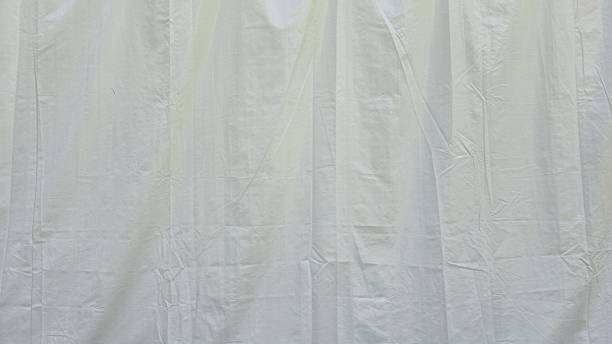 istock The white canvas is wrinkled and creased. White fabric texture with wrinkled texture. 2252759021
