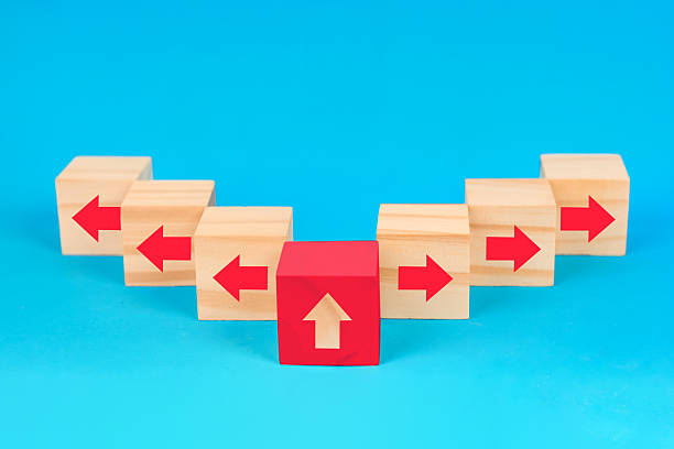 istock A standout direction cubes concept showing an upward leader among opposite flows to illustrate guidance breakthrough and strategic advancement. 2252760930
