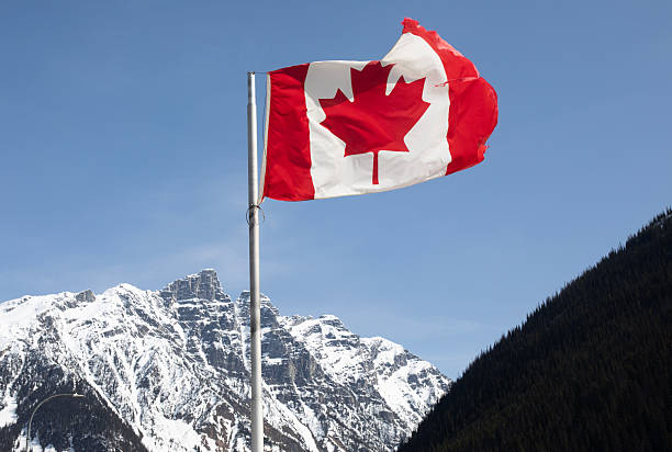 istock Canada flag , snowy mouuntains 2252762776