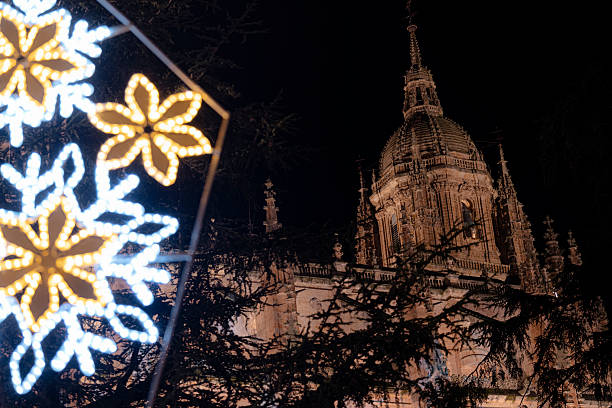 Salamanca cathedral dome with illuminated snowflake decoration at night