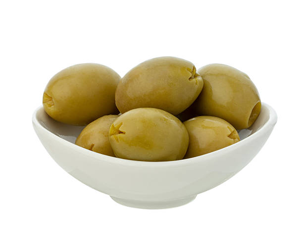 istock Olives in a sauceboat on a white isolated background 2252766946