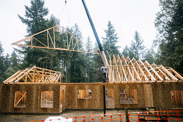 istock Construction Crew Putting Up Framing of New Home 2252767293