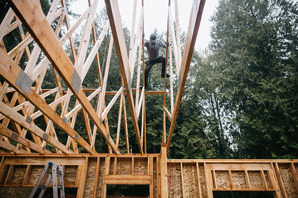 istock Construction Crew Putting Up Framing of New Home 2252767365