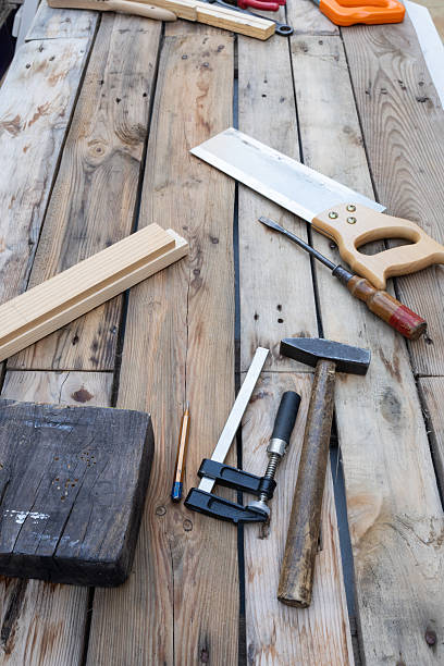 istock Woodworking tools and wood pieces on wooden workbench 2252768562