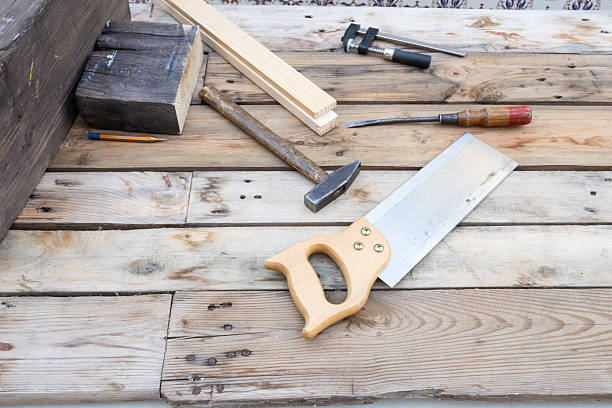 istock Woodworking tools and timber on a rustic wooden workbench 2252769212