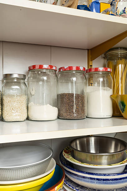 istock Kitchen pantry shelves holding dry goods and kitchenware 2252769271
